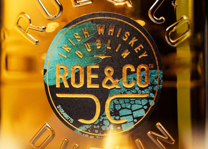 Blueprint-style image of Roe & Co bottle design