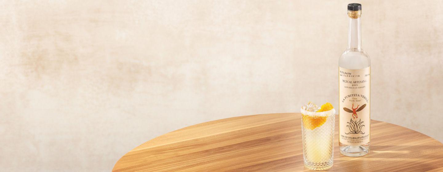 Bottle and cocktail on a table