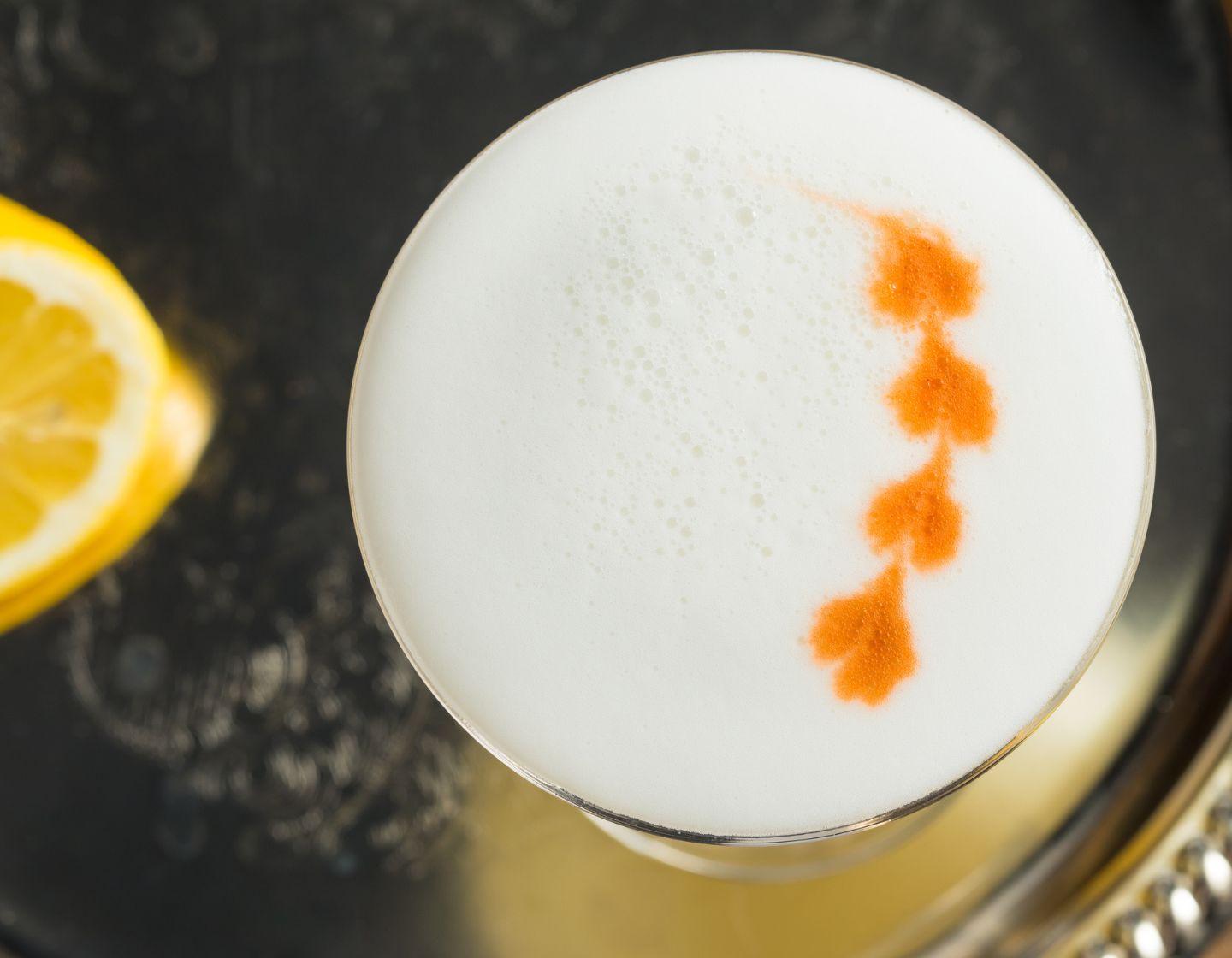 Foam cocktail with orange pattern.