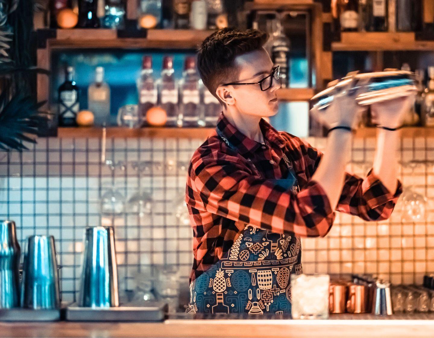 Bartender using a cocktail shaker.