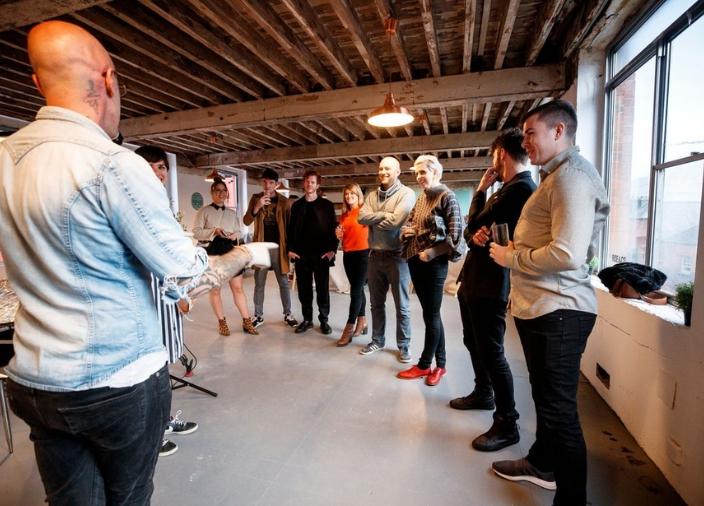 Bar professionals standing in a room together
