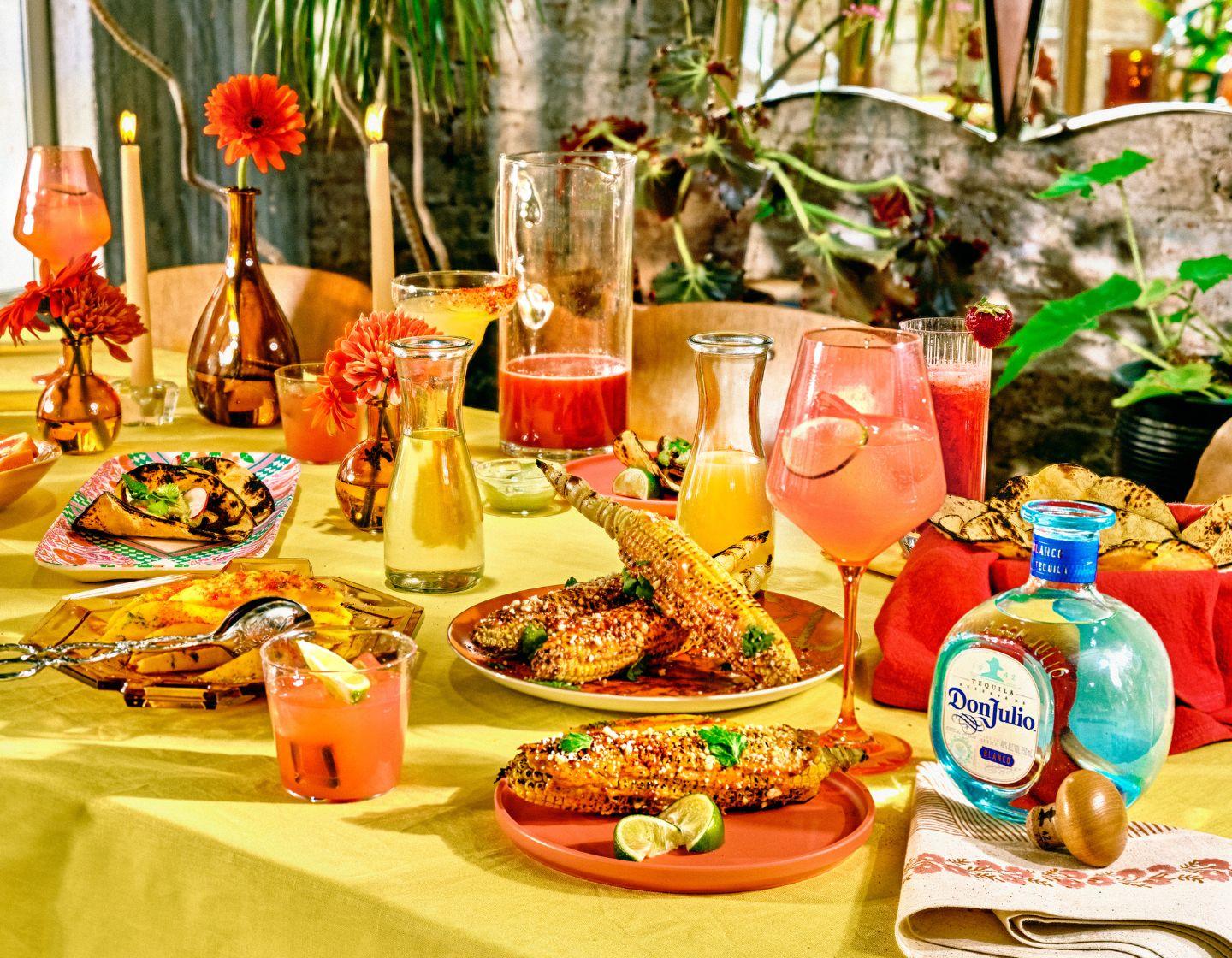 Colourful table with food and cocktails.