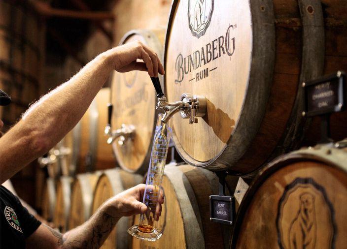 Bundaberg rum being poured from a cask.