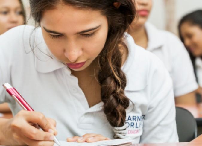 Girl in Learning Skills for Life™ shirt writing