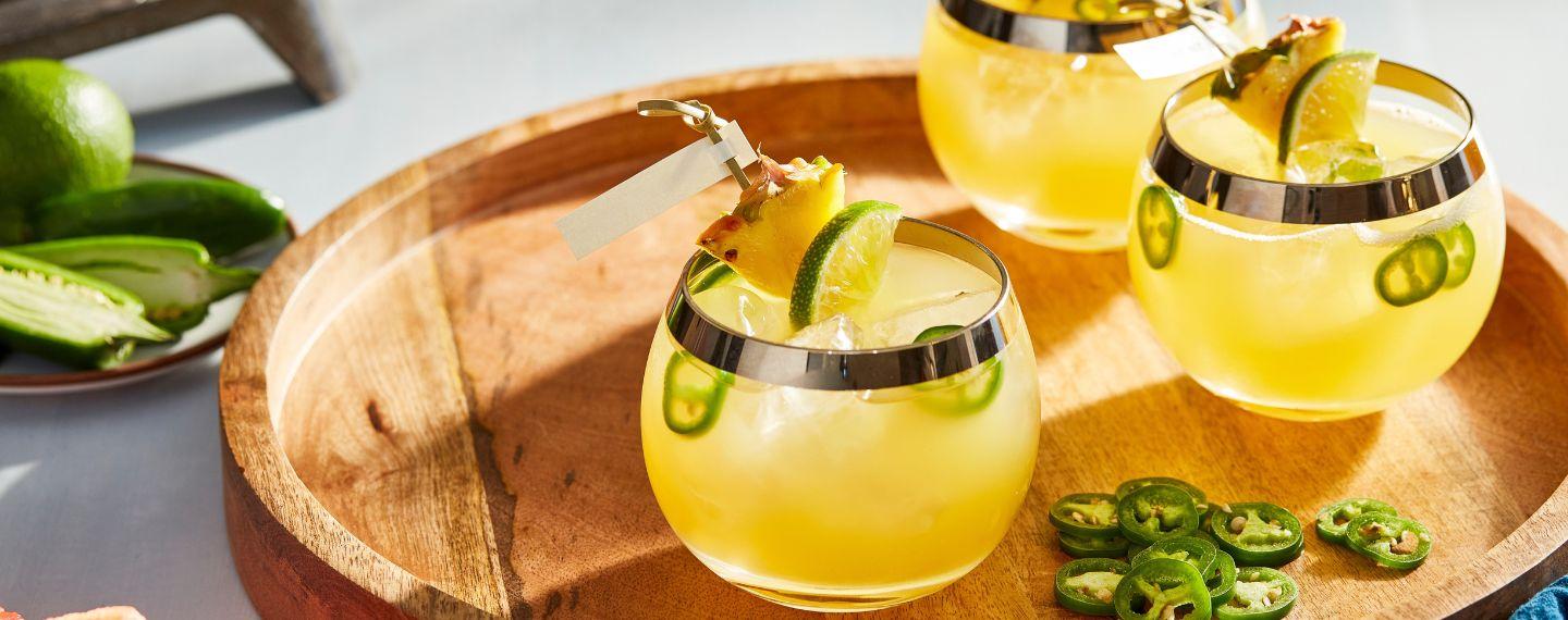 three cocktails on a tray