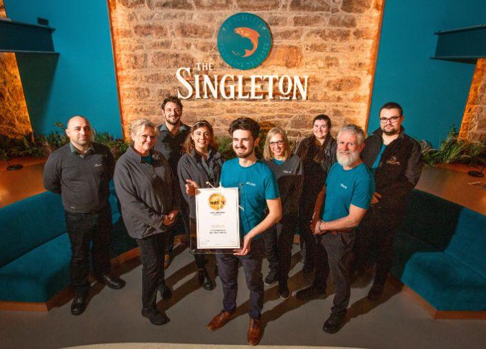 The Singleton team recieving an award.