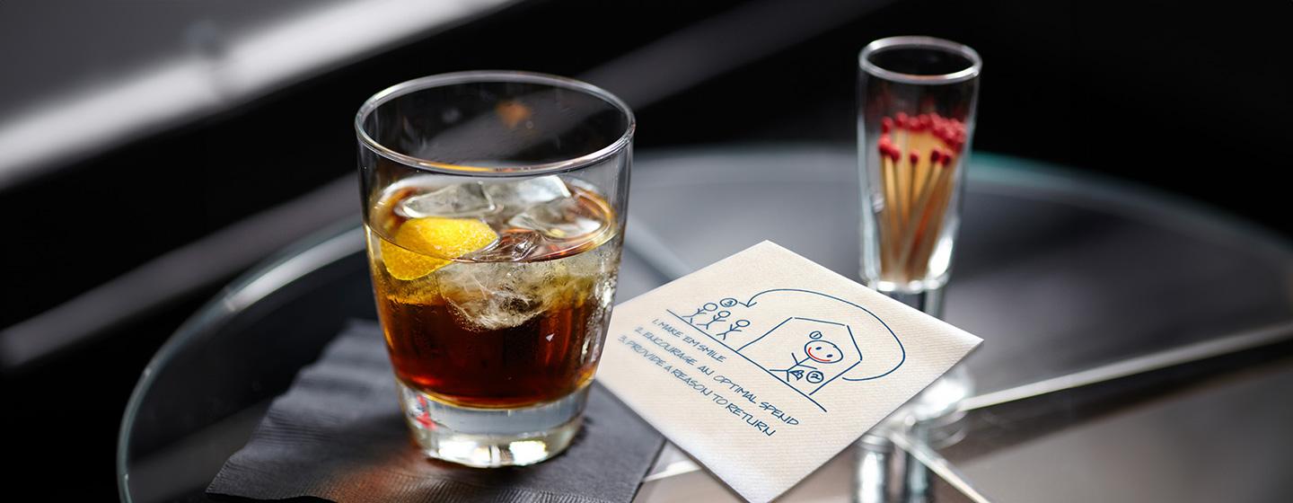 Cocktails on a table with notes on a napkin