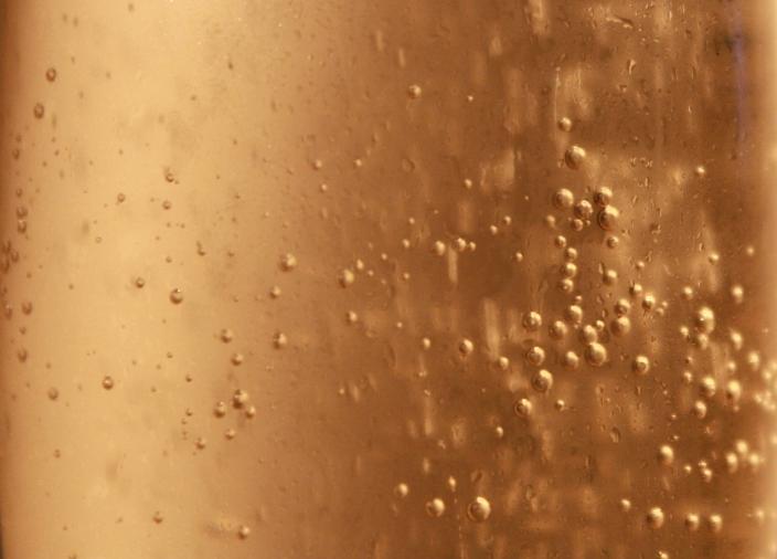 Close up view of prosecco bubbles
