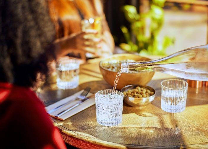Water being poured for a guest