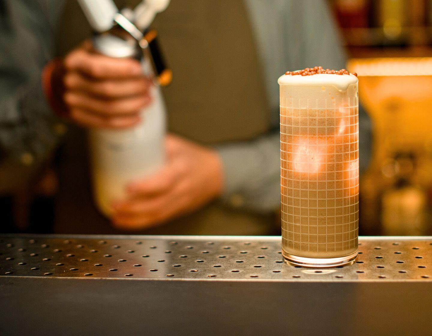 Foam cocktail on a bar.