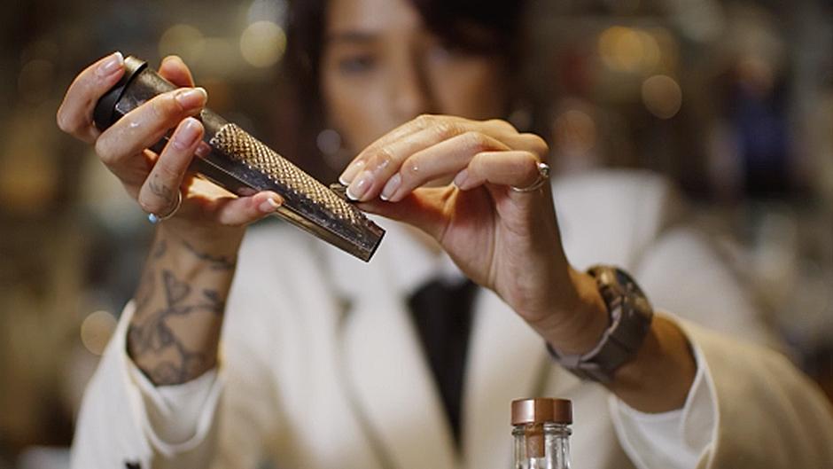 Bartender with a garnish tool