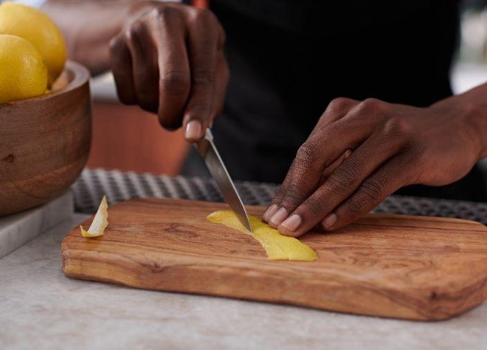 Lemon garnish being carefully cut