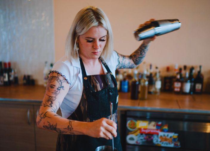 Eve Green using a cocktail shaker.