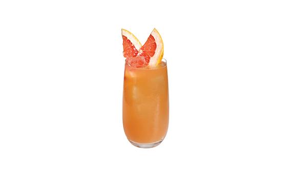 Black paloma cocktail glass decorated with grapefruit