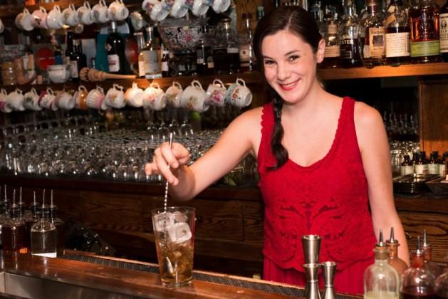 Jillian Vose behind the bar making a cocktail