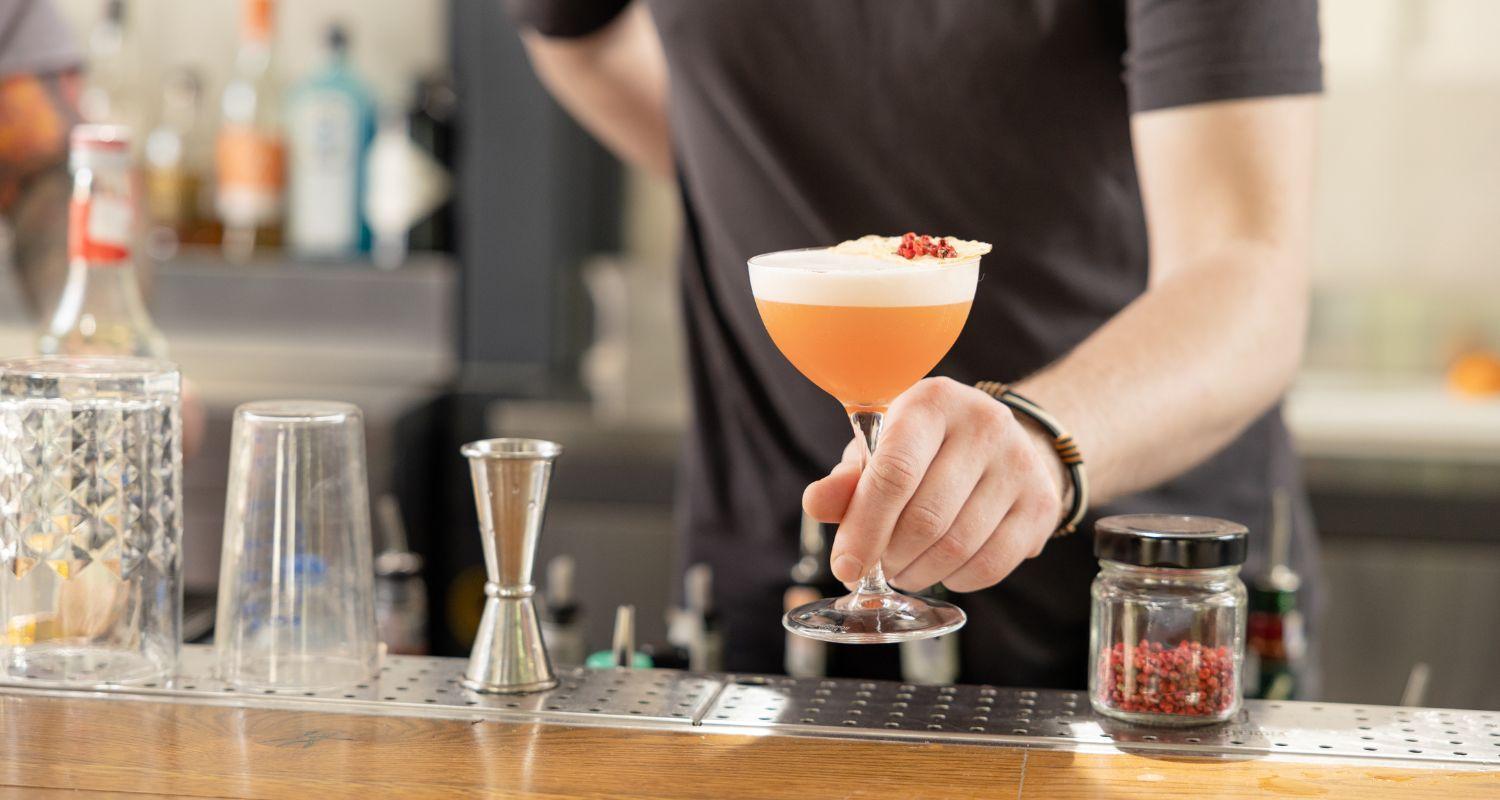 cocktail being served at bar
