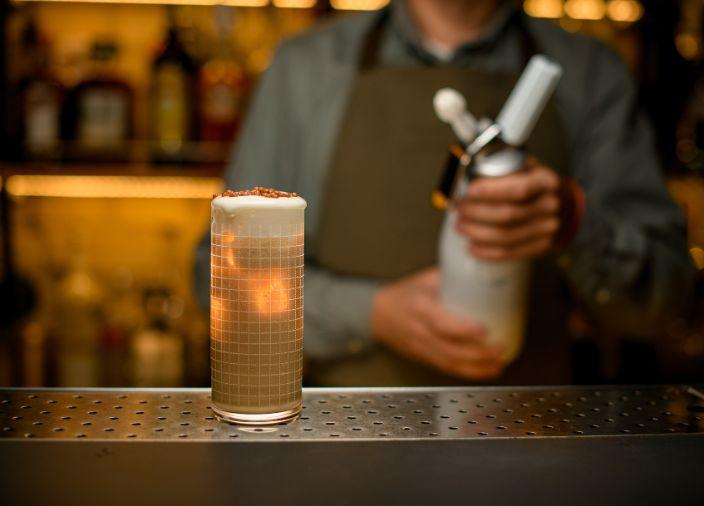 Bartender with foam tool.