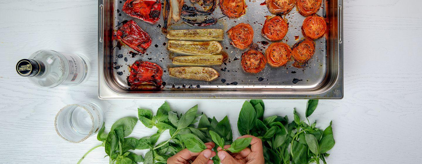 bartender holding mint with seasonal ingredients