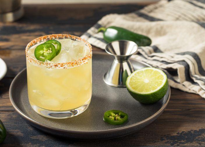 Margarita in tumbler glass with lime.