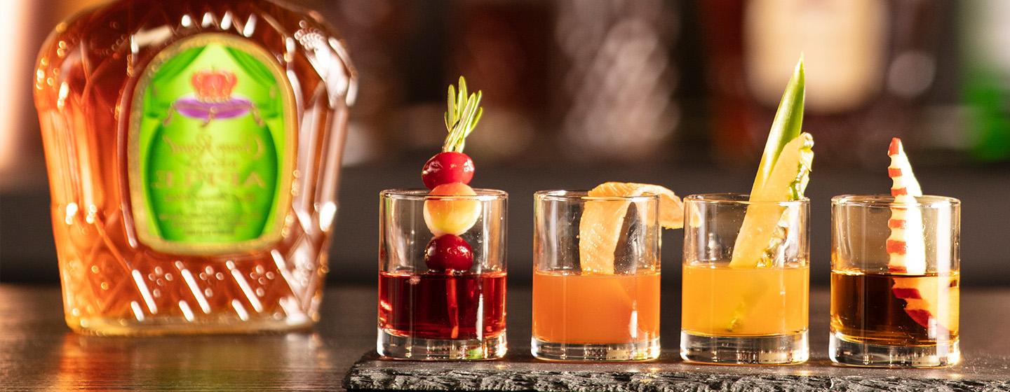 flight of cocktails with bottle