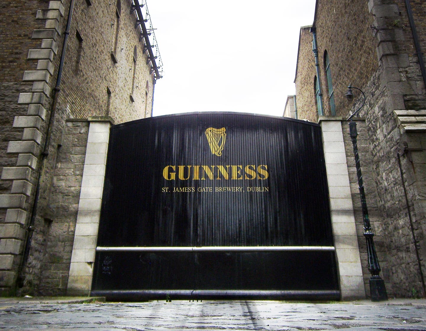 Guinness brewery St James Gate with yellow harp icon and Guinness wordmark. 