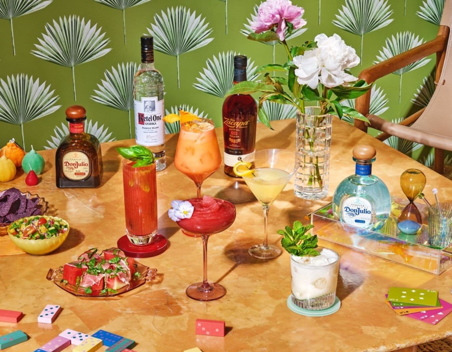 Assortment of colourful cocktails and spirit bottles.
