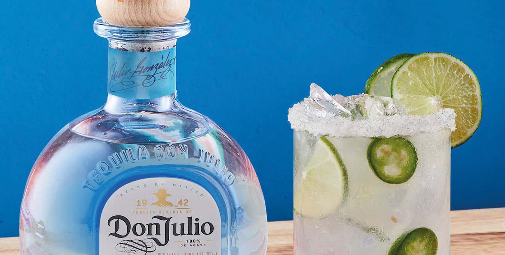 A bottle of Don Julio Tequila beside a Spicy Margarita 