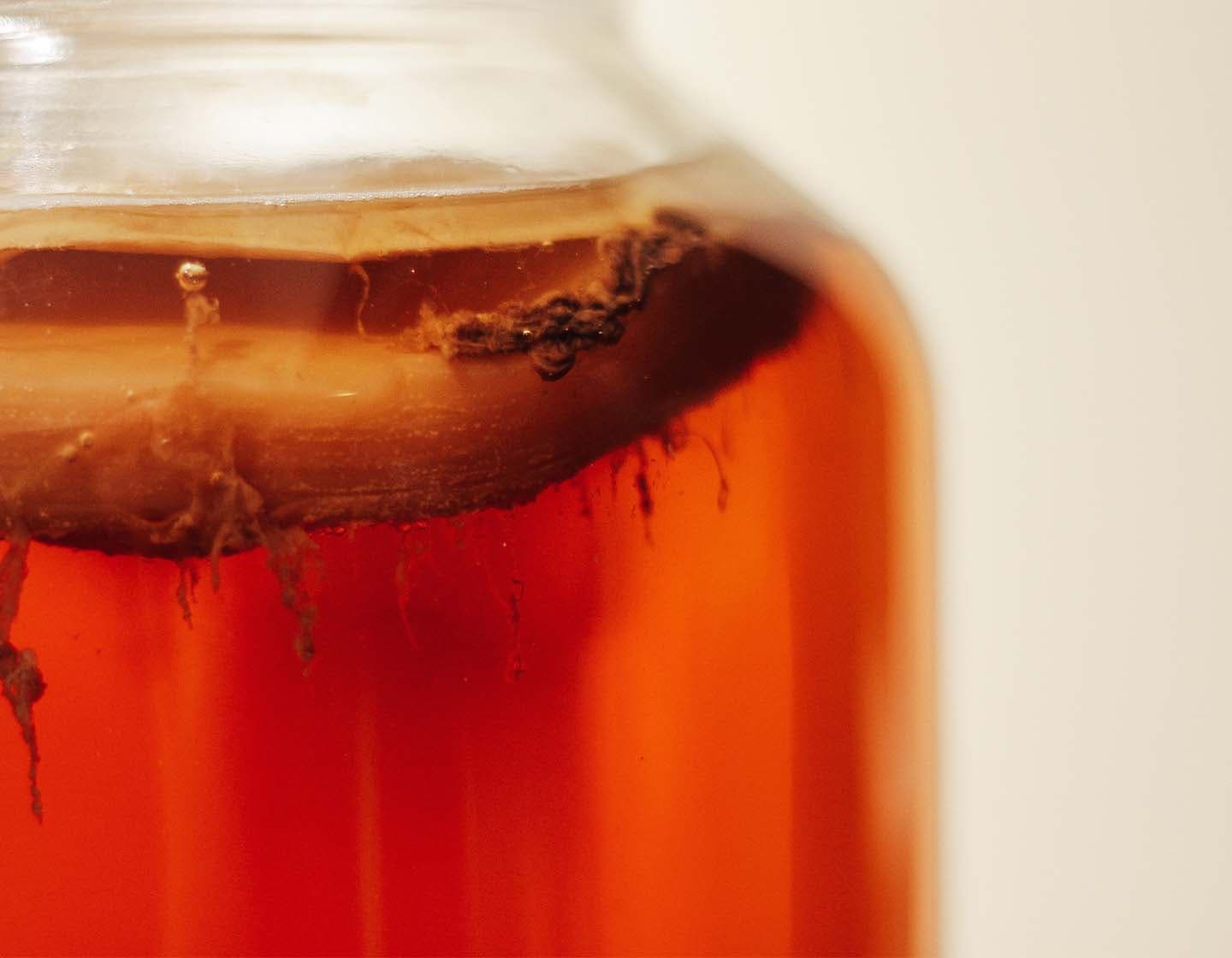 Close up shot of fermenting liquid in a jar