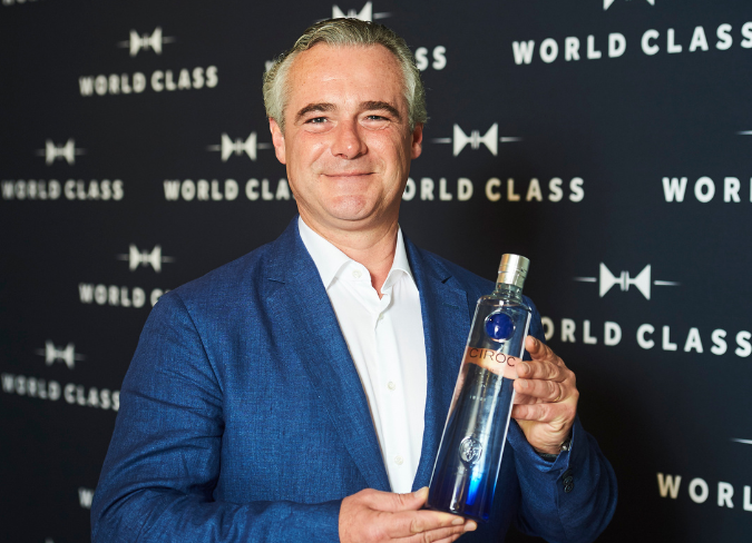 Man (CÎROC Master Blender) holding bottle of vodka