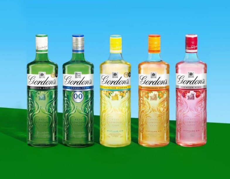 Five colourful spirit bottles.