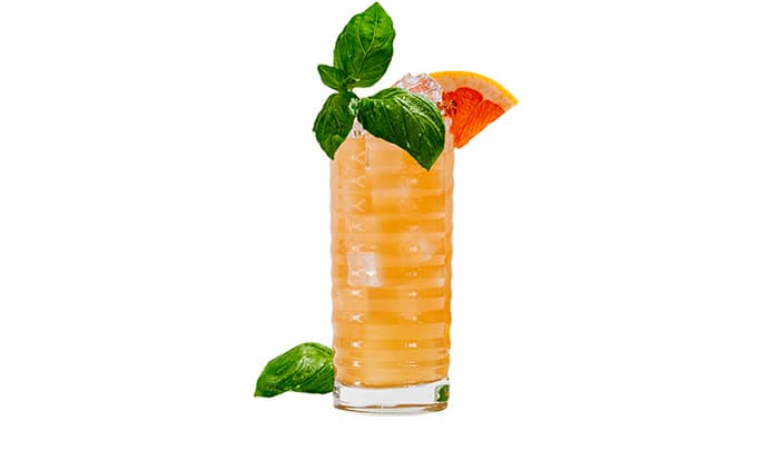 21Seed Seed Paloma cocktail with grapefruit and basil garnish