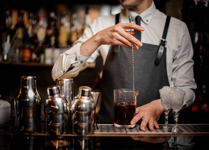 Bartender stirring a cocktail