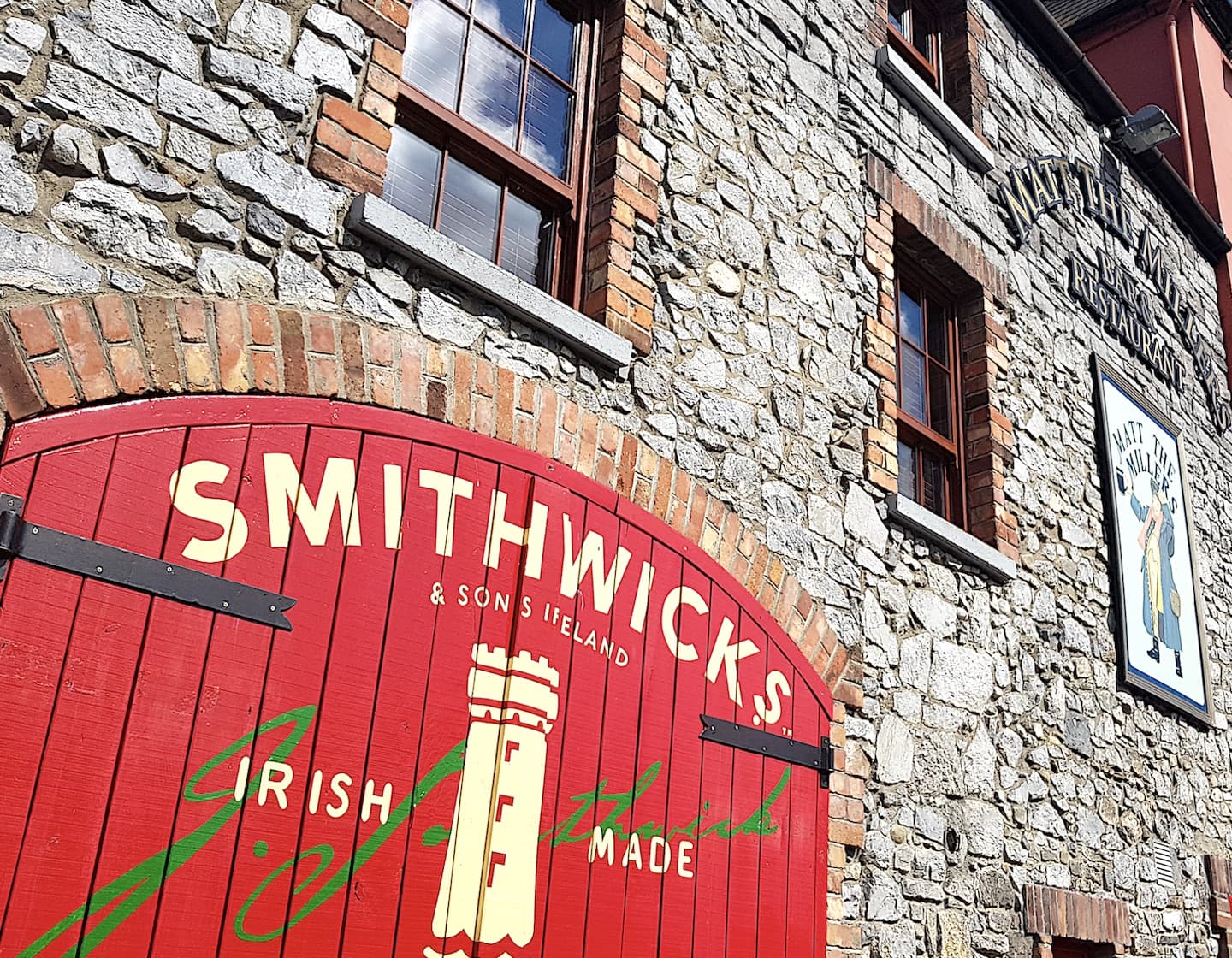 Red door entrance to the Smithwick's distillery