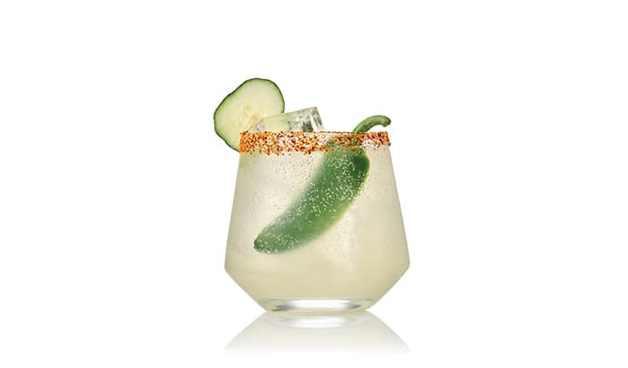 21 Seeds Spicy Seed Margarita cocktail in a glass with pepper garnish