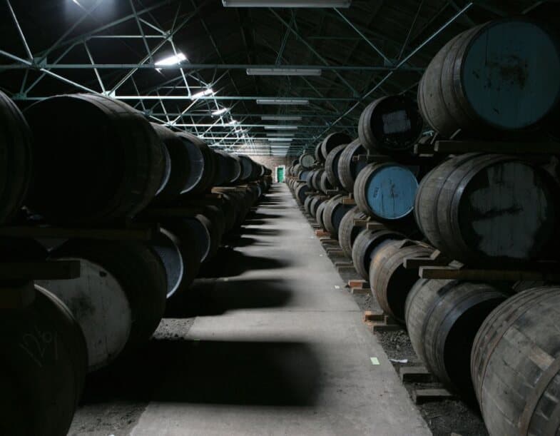 Rows of wooden casks in storage