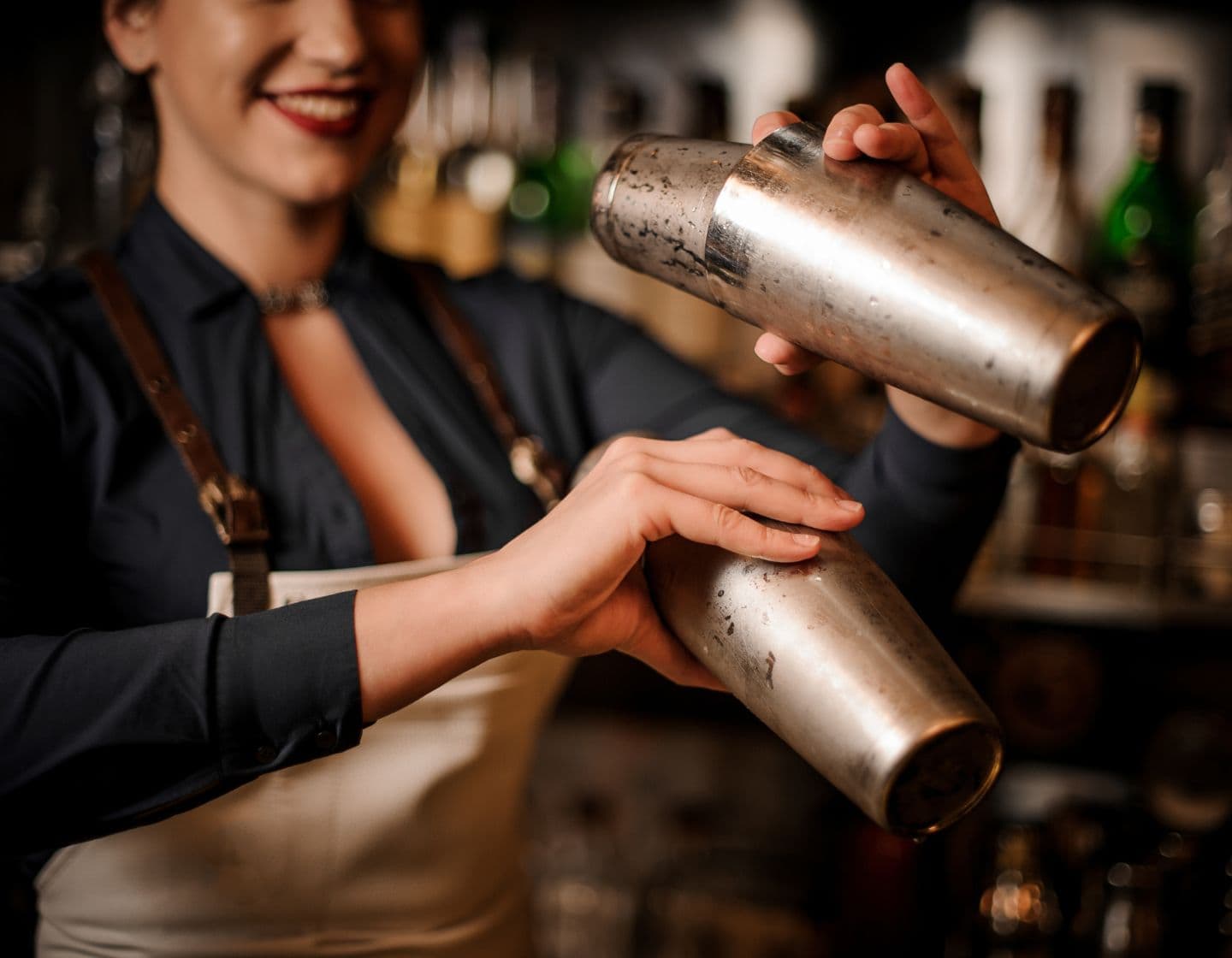 Bartender shaking cocktail shakers